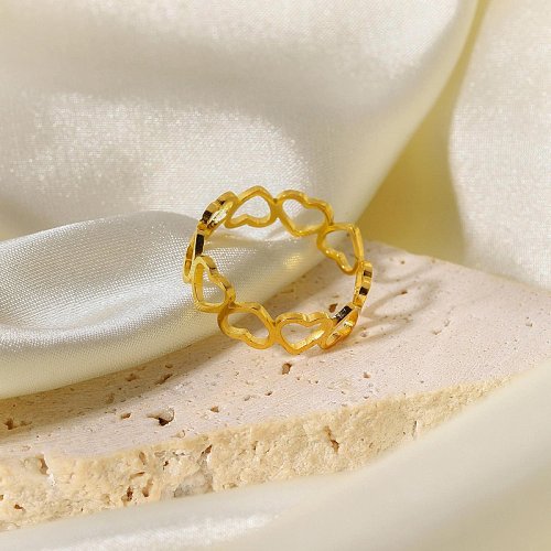 anel de aço inoxidável banhado a ouro simples de emenda oca coração atacado jóias