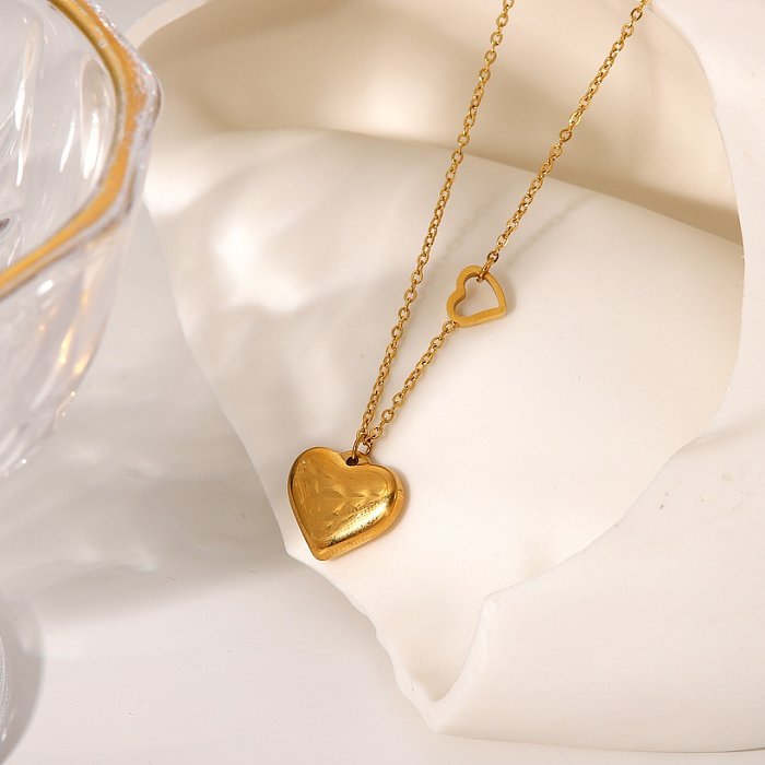 Collier pendentif double cœur en acier inoxydable plaqué or 18 carats