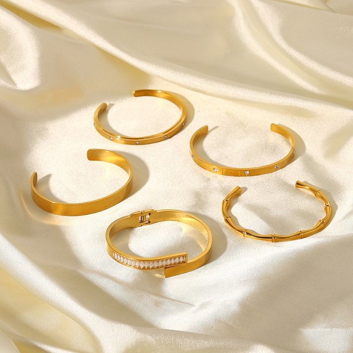 Pulsera de acero inoxidable chapada en oro de 18 quilates retro de moda abierta con incrustaciones de circón para mujer