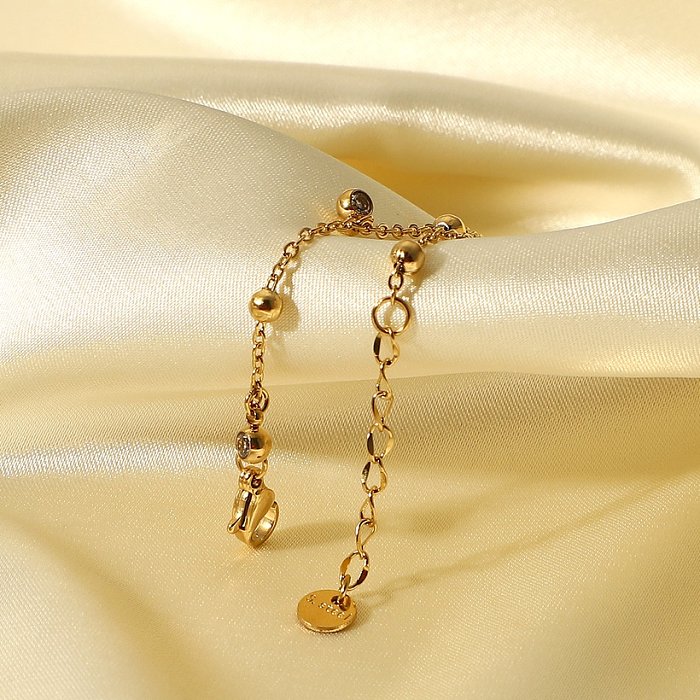 Pulsera de acero inoxidable con cinco borlas de circón pequeño chapado en oro de 14 quilates a la moda