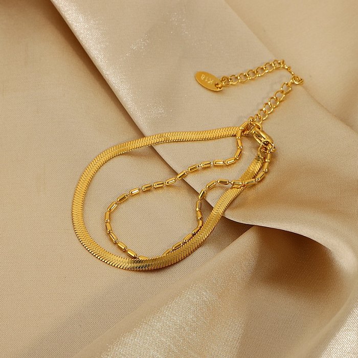 Pulsera de acero inoxidable chapada en oro de 18 quilates con cadena de serpiente de doble capa de moda
