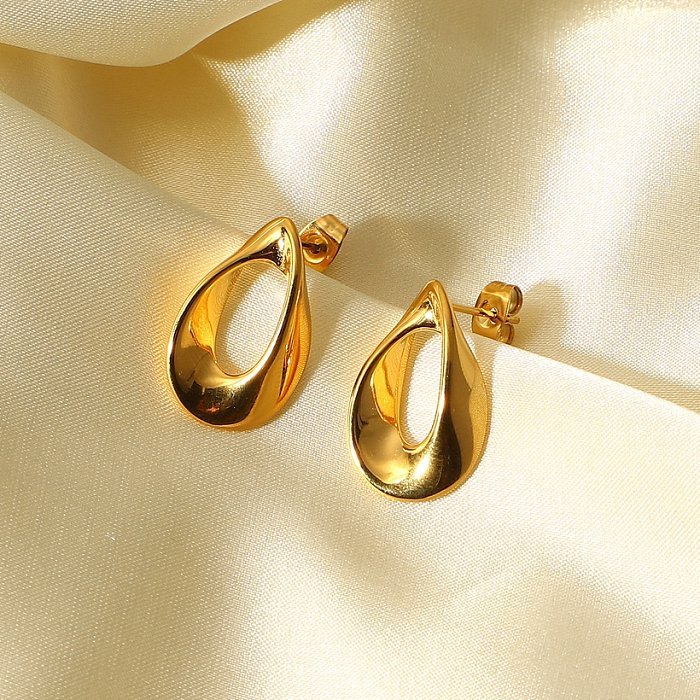 fashion simple 18K goldplated stainless steel hollow buttonshaped stud earrings