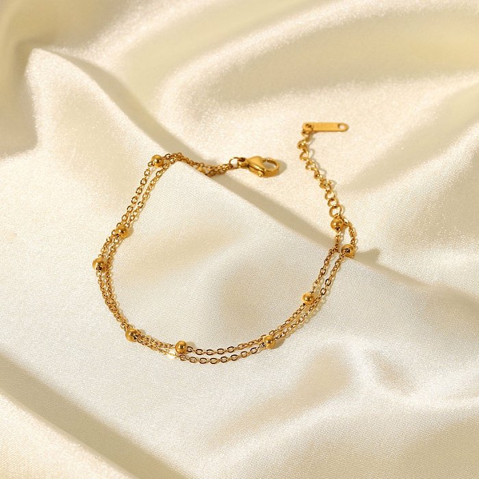 Bracelet simple en acier inoxydable plaqué or 18 carats avec perle double couche