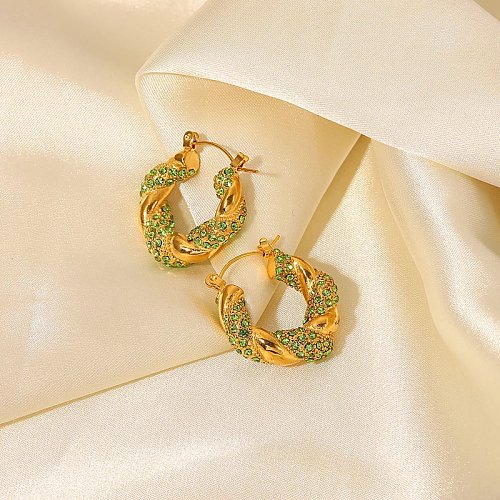 Boucles d'oreilles en acier inoxydable torsadé en or 18 carats incrustées de zircon vert à la mode