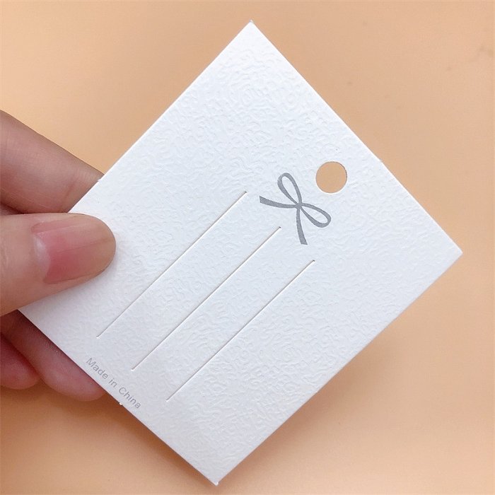 Sacos de embalagem de joias de papel com nó de laço de cor sólida fashion