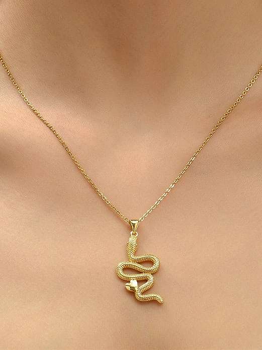 Collier pendentif serpent vintage en laiton
