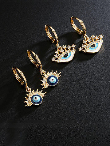 Boucles d'oreilles vintage Huggie en laiton et émail de zircone cubique Evil Eye