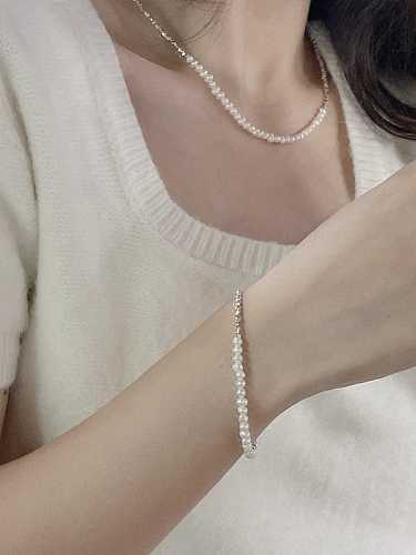 Delicado conjunto de collar y pulsera de perlas de agua dulce de plata de ley 925