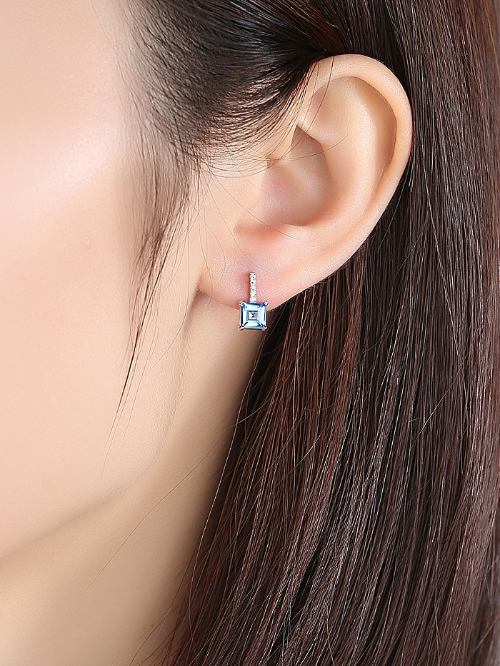 Ohrring aus synthetischem Topas mit Mikro-Intarsien aus Sterlingsilber mit blauem Zirkoniaquadrat