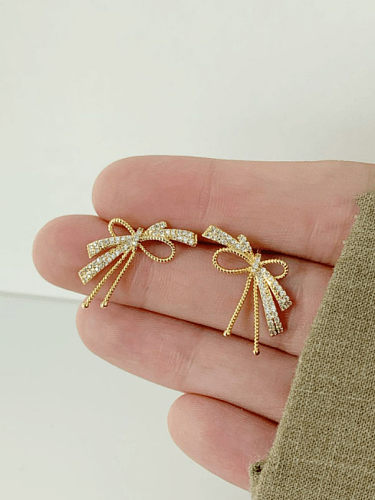 Boucles d'oreilles mignonnes en argent sterling 925 avec zircon cubique et nœud papillon
