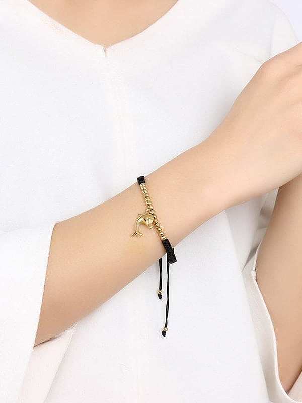 Pulsera de titanio chapado en oro con forma de delfín de longitud ajustable