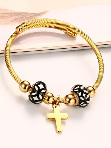 Requintada pulseira de titânio banhada a ouro em forma de cruz