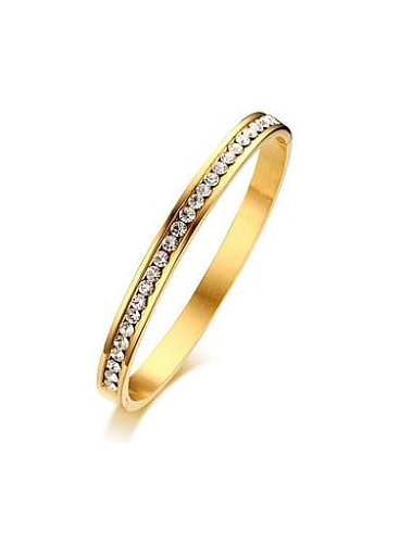 Exquisito brazalete de titanio con diamantes de imitación brillantes chapados en oro