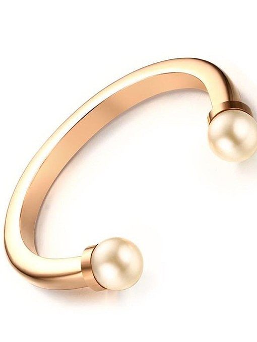 Bracelet en acier inoxydable avec perles synthétiques dorées