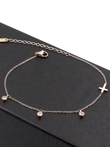 Tobillera con cruz de titanio y circonitas cúbicas delicadas