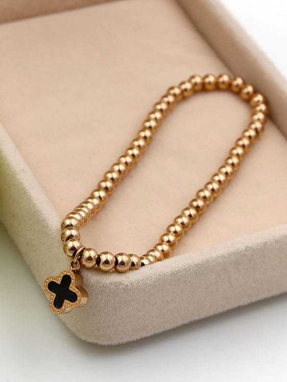 Bracelet perlé classique en titane avec fleur de coquillage