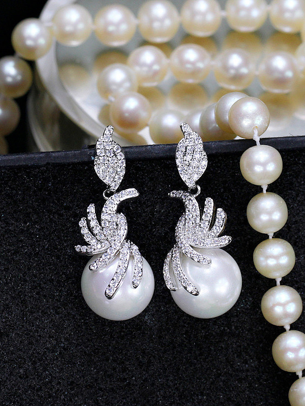 Boucles d'oreilles élégantes en perles de coquillages de style occidental