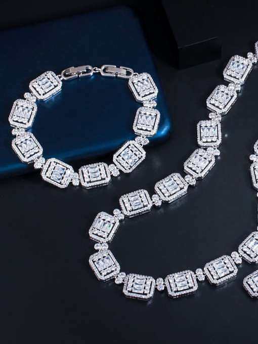 Ensemble bracelet et collier de boucles d'oreilles géométriques de luxe en laiton et zircone cubique
