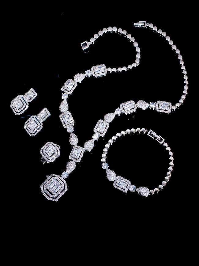 Ensemble de bracelets et de colliers de boucles d'oreilles géométriques de luxe en zircon cubique en laiton