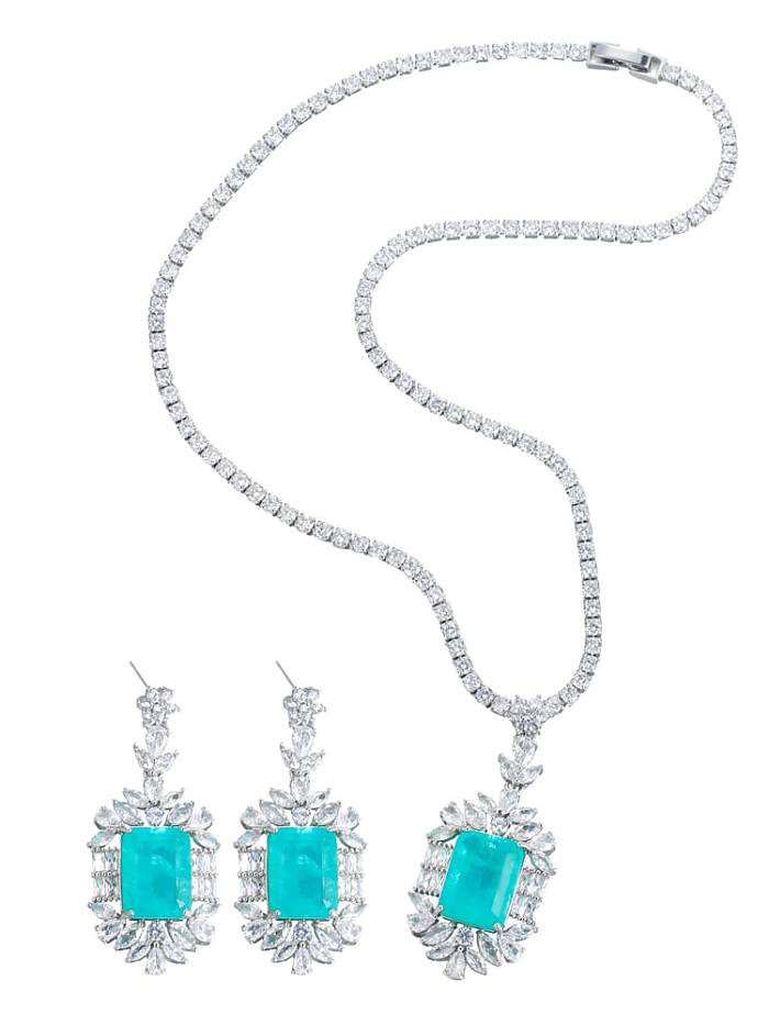 Luxuriöses Set aus geometrischem Zirkonia-Ohrring und Halskette aus Messing