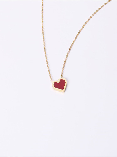 Collares de titanio con corazón simplista chapado en oro