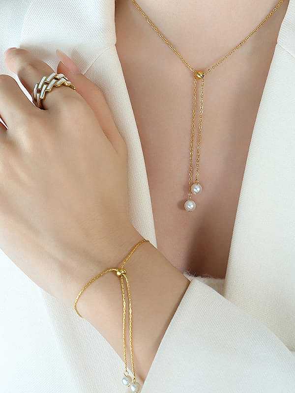 Conjunto de pulsera y collar de perlas de imitación de acero y titanio Trend Tassel