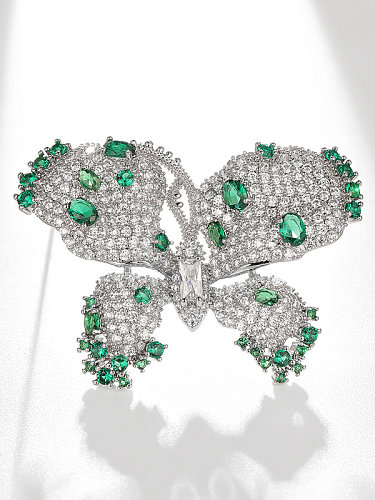Zierliche Brosche aus Messing mit österreichischen Kristallen und grünem Schmetterling