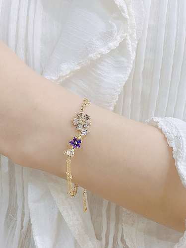 Zierliches Strang-Armband mit Zirkonia-Blume aus Messing