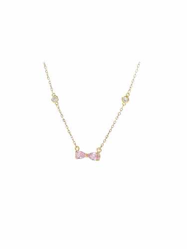 Zierliche Halskette mit rosa Schleife aus Messing und Zirkonia