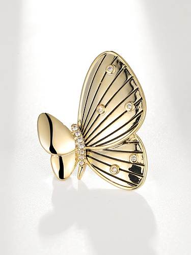 Broche minimaliste papillon en laiton et zircon cubique