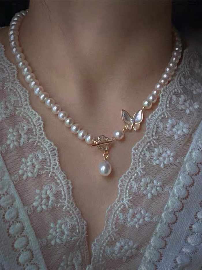 Collier de perles vintage en forme de papillon et de perles d'eau douce