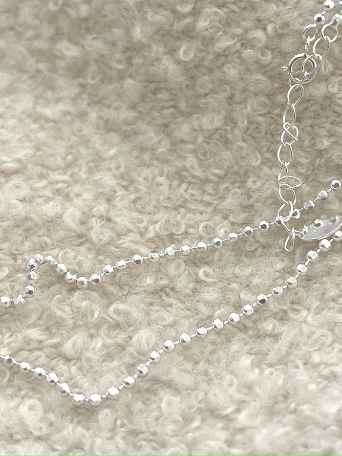 Minimalistische Halskette aus 925er Sterlingsilber mit runden Perlen