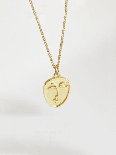 Halskette mit abstraktem Gesicht aus Sterlingsilber und Gold