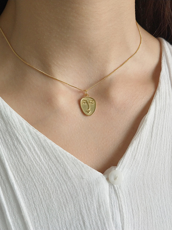 Sterling silver gold abstract face necklace