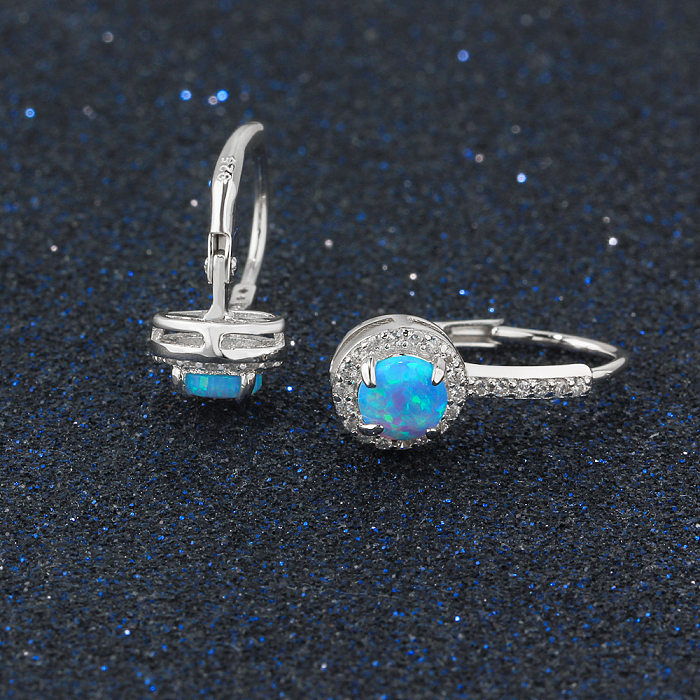 Boucle d'oreille créole en opale bleue et zircone