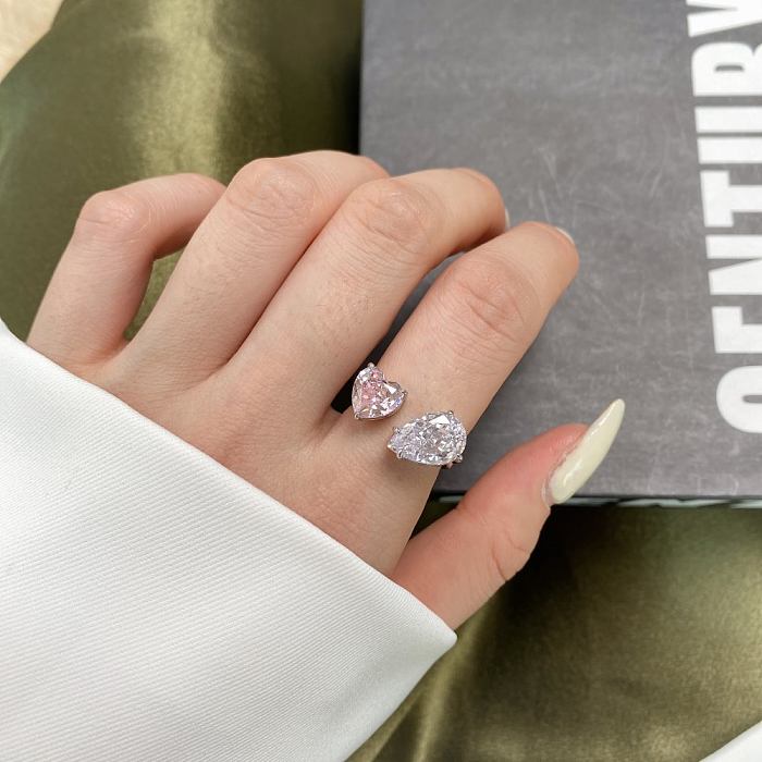 Anillo de dedo de lujo con circonita en forma de pera y corazón rosa