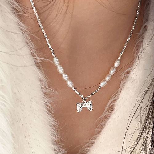 Pearl Crushed Silver Bow Pendant Necklaces