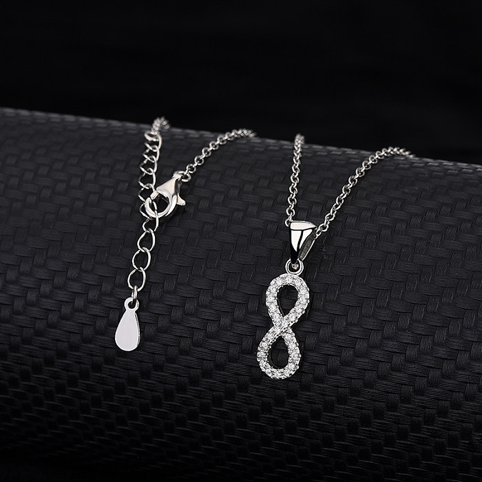 Silbernes Infinity-Ohrring-Halsketten-Set mit Zirkonia