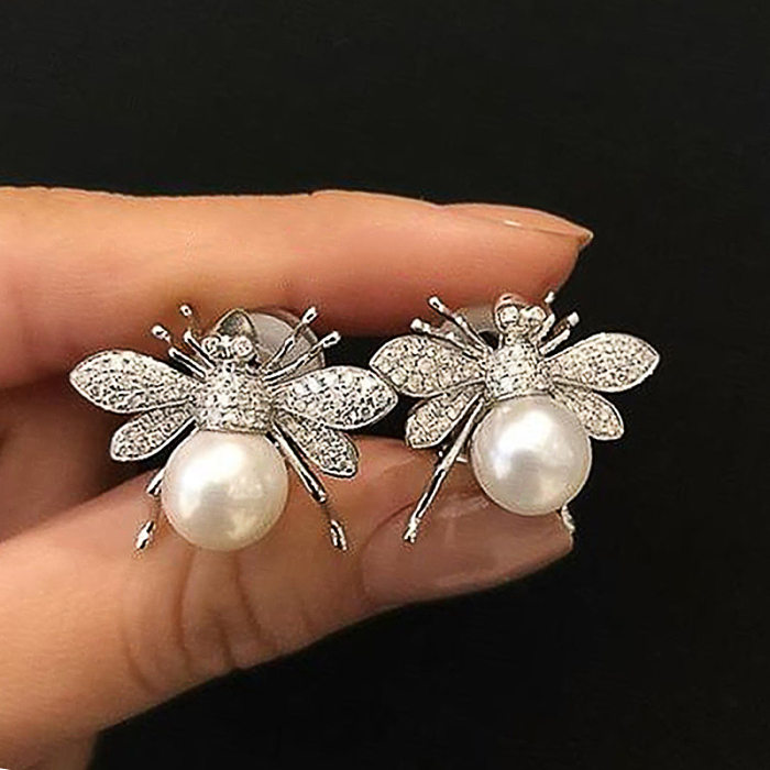 1 paire de clous d'oreilles en pierres précieuses artificielles en cuivre avec incrustation d'abeille mignonne