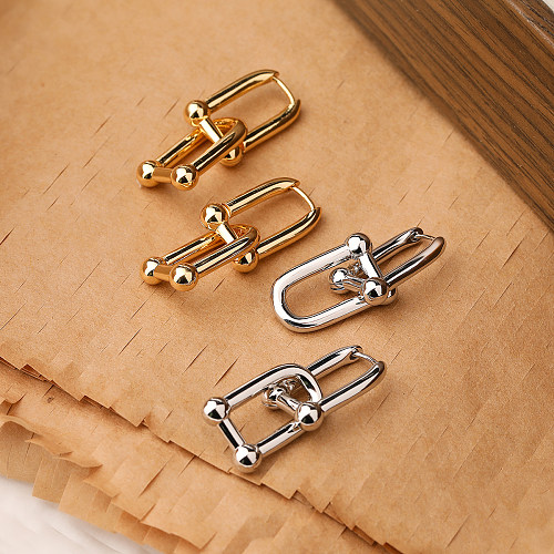 1 paire de boucles d'oreilles pendantes en cuivre plaqué or 18 carats, style streetwear simple et géométrique