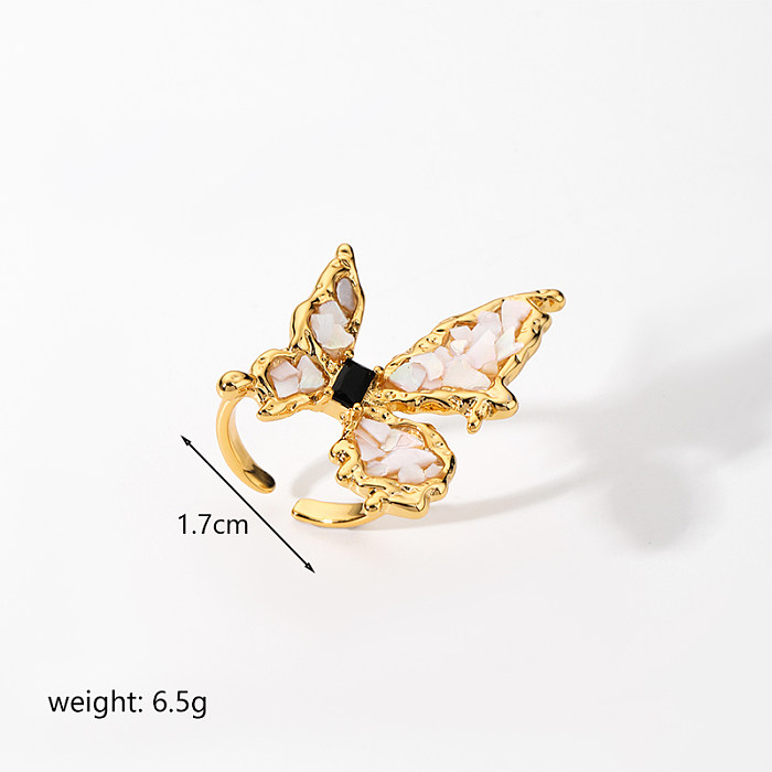 Elegante offene Ringe mit Schmetterlingsverkupferung und Inlay aus Zirkon mit 18-Karat-Vergoldung