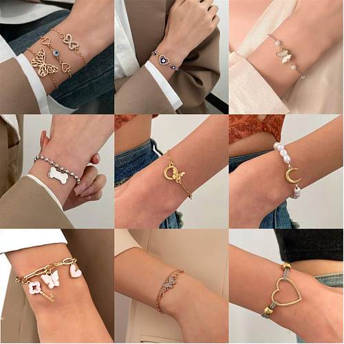 Señora Estilo moderno Luna brillante Forma de corazón Mariposa Resina Cobre Chapado en oro de 18 quilates Chapado en oro Pulseras de circón plateadas a granel