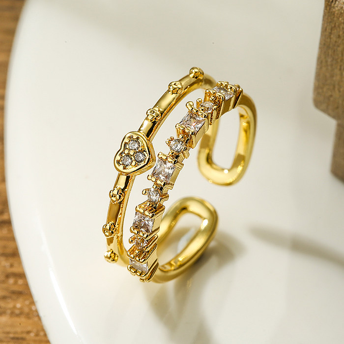 Moderner offener Ring in herzförmiger Form mit Kupferbeschichtung und Zirkoneinlage, 18 Karat vergoldet