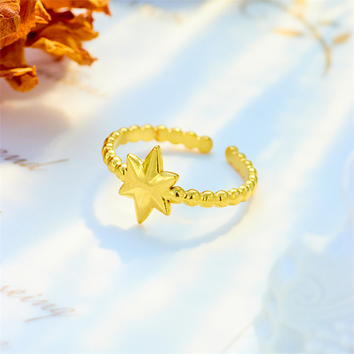 Offener Ring „Basic Cross Star“ aus vergoldetem Titanstahl, 1 Stück