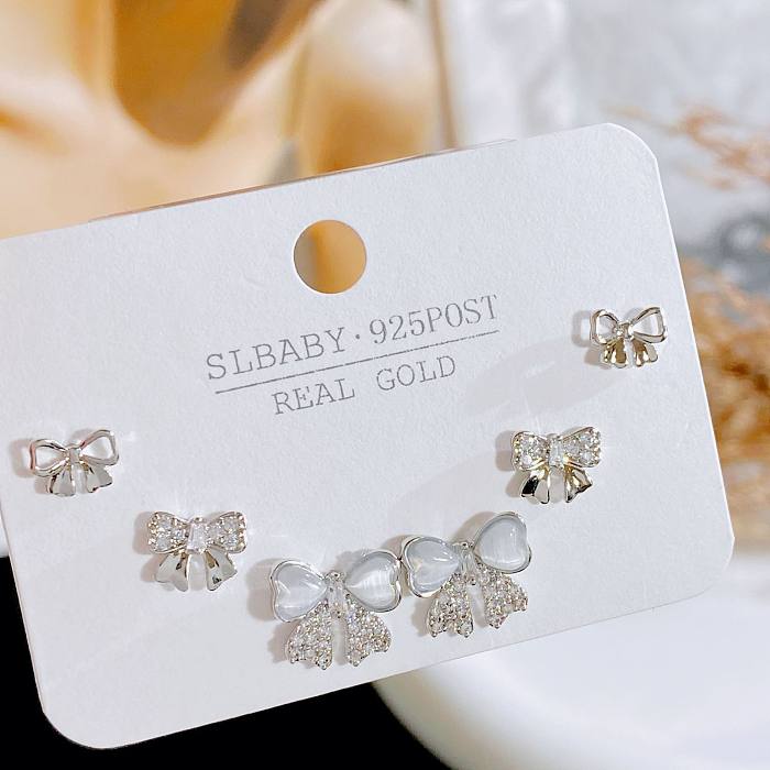 Simple Style Geometric Heart Shape Bow Knot Copper Plating Inlay Artificial Gemstones Ear Studs