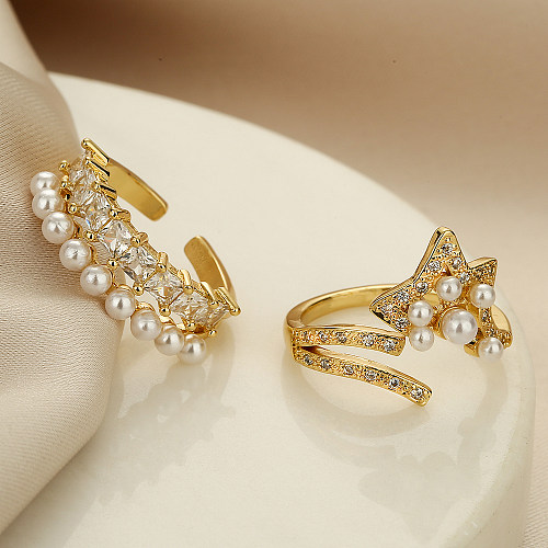 Anillo abierto chapado en oro de 18K con circonita de perlas artificiales con incrustaciones de cobre y estrella geométrica de estilo simple