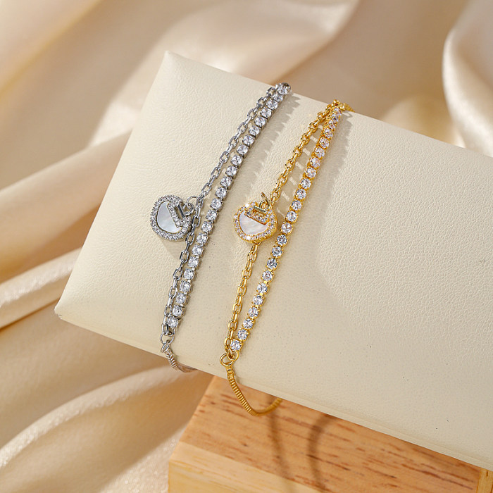 Elegante, glänzende, mit 14-karätigem Gold plattierte Armbänder mit Schlossverkupferung und Inlay aus Muschelzirkon