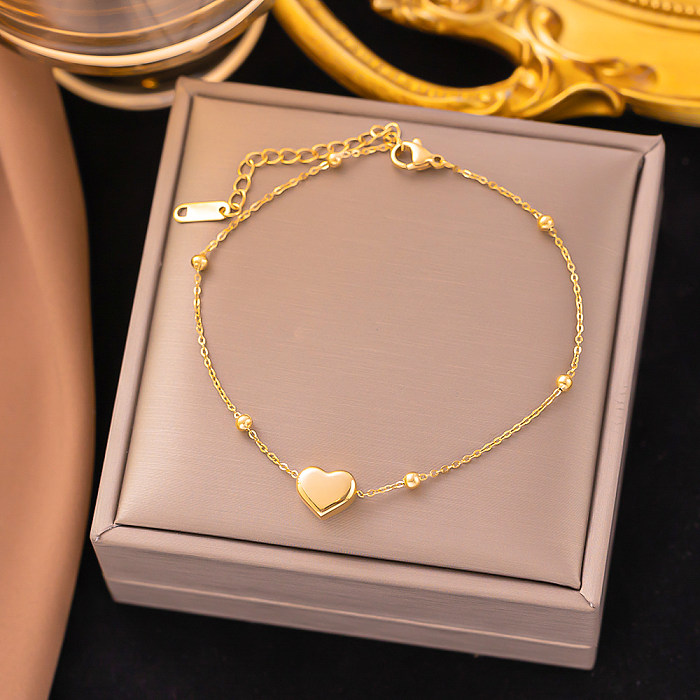 Collar de pulseras chapado en oro de 18 quilates con revestimiento de acero de titanio en forma de corazón de estilo simple informal