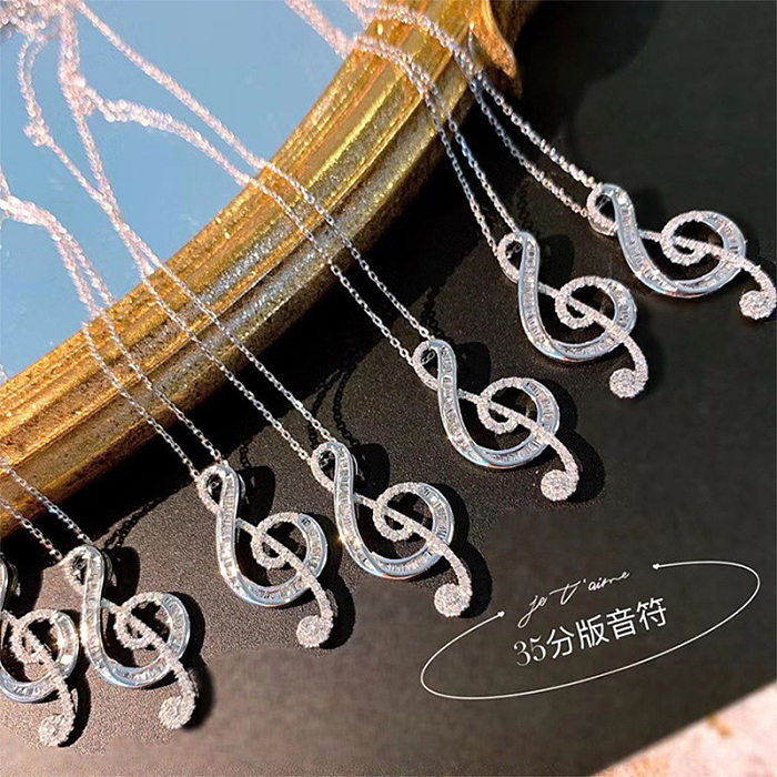 Modische Halskette in Form einer Musiknote mit eingelegtem Zirkon und Kupfer
