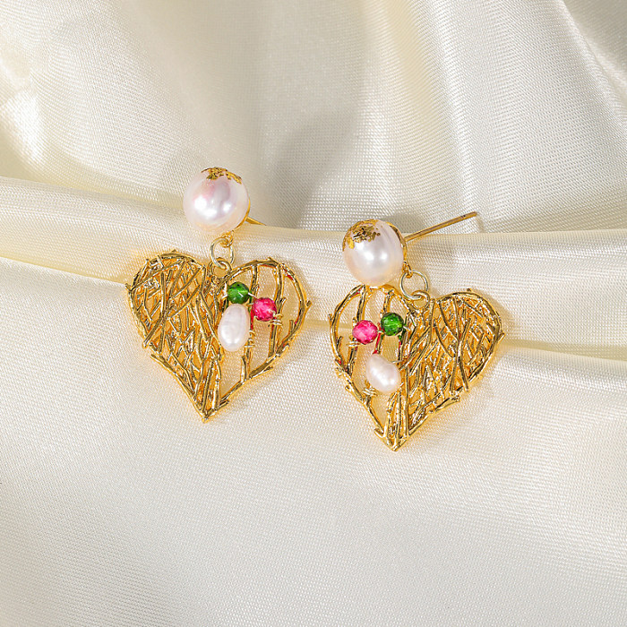 1 par de aretes colgantes chapados en oro de 18 quilates con incrustaciones huecas y perlas de cristal artificial de cobre con forma de corazón y estrella de lujo informal